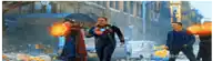 a group of men are walking down a street with fire coming out of their mouths