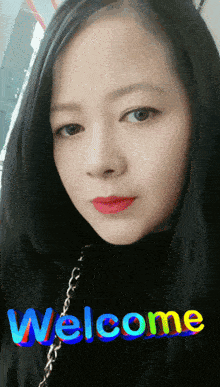 a woman 's face is shown with the word welcome behind her