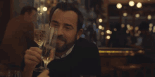 cheers adrian justin theroux false positive champagne