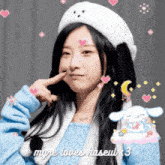 a girl wearing a white hat and a blue sweater says myre loves haseul