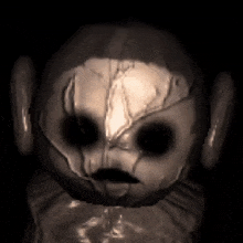a black and white photo of a creepy teletubbies character with a broken head .