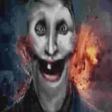 a close up of a person 's face with a tooth missing and a fire in the background .