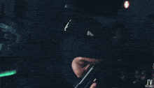 a blurry image of a person 's torso with the letters sv visible on the bottom