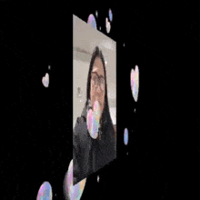 a woman wearing glasses is surrounded by hearts and the words welco on the bottom