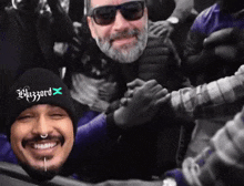 a man wearing a beanie that says whazard x