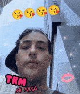 a man with a tattoo on his neck is surrounded by emojis and the words tkm mi nina