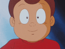 a close up of a child 's face with big eyes and a red shirt