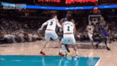 a basketball game is being played in a stadium with a sign that says golden hoops