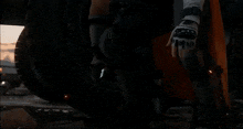 a man wearing a skull mask with a hood