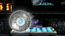 a video game is being played with a purple character and a circle with a blue eye on it
