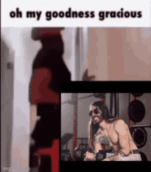 a man with long hair is lifting weights in a gym