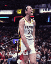 a female basketball player wearing a jersey that says fever 22 on it