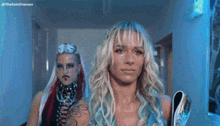 two women are standing next to each other with the hashtag thekomdreesen on the bottom left