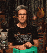 a man wearing a good mythical morning shirt