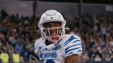 a football player wearing a helmet and a jersey that says memphis
