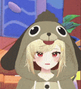 a girl wearing a dog hooded sweatshirt with a poop on her head