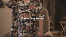 a man sitting in a chair with the words bounce quiny bounce