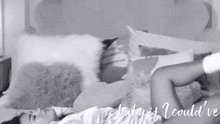 a woman laying on a bed with the words baby it i could 've