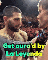a man talking to another man with the words get aura 'd by la leyenda above him