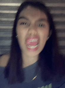 a woman making a funny face with her mouth open