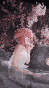 a woman with pink hair is sitting in a bathtub with cherry blossoms in the background