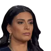 a close up of a woman wearing dior earrings and a necklace