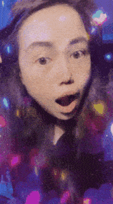 a woman with a surprised look on her face is surrounded by a colorful background