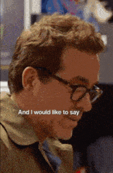 a close up of a man wearing glasses with the words " and i would like to say " below him
