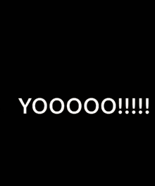 a man is sitting in front of a microphone and saying yoooo !!! .