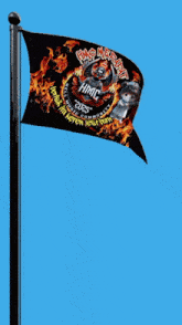 a black flag with flames and the letters hmc