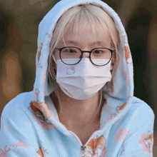 a woman wearing glasses and a hello kitty mask