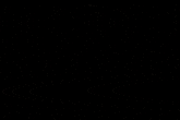 a silhouette of a person standing in front of a wall with hieroglyphs