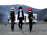 a group of cartoon characters are walking in a field with mountains in the background