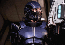 a man in a blue helmet has the number 2 on his chest