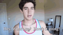a young man says hey what 's up how 's it going in front of a mirror