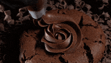 a close up of a chocolate swirl with a lot of pieces of chocolate coming out of it