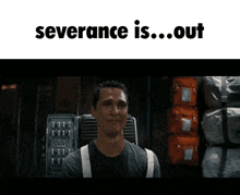 a man in a warehouse with the words severance is out above him