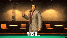 a man in a suit is standing in front of a pool table with the word yosh written on the bottom