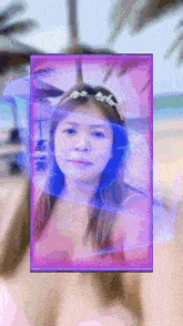 a picture of a woman with a purple frame around her face