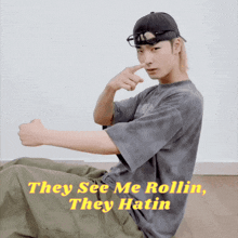 they see me rollin they hatin written on a picture of a man