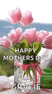 a bouquet of pink flowers in a vase with the words `` happy mothers day gracie '' .