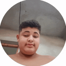 a shirtless young man in a circle with a gray background