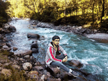 prosen sitting at river