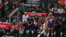 a gatorade sign is behind a basketball hoop during a basketball game
