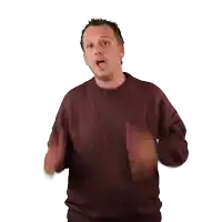 a man in a maroon sweater is making a gesture with his hands