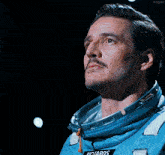 a man in a blue space suit with the word rio yards on the front