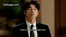 a man in a suit and tie says i feel a bit solemn right now