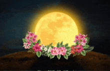 a full moon is surrounded by pink flowers and green leaves .
