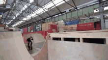 a person riding a skateboard down a ramp with the word ed on the wall behind them
