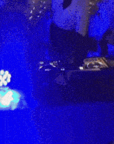 a blurry picture of a dark room with a blue light